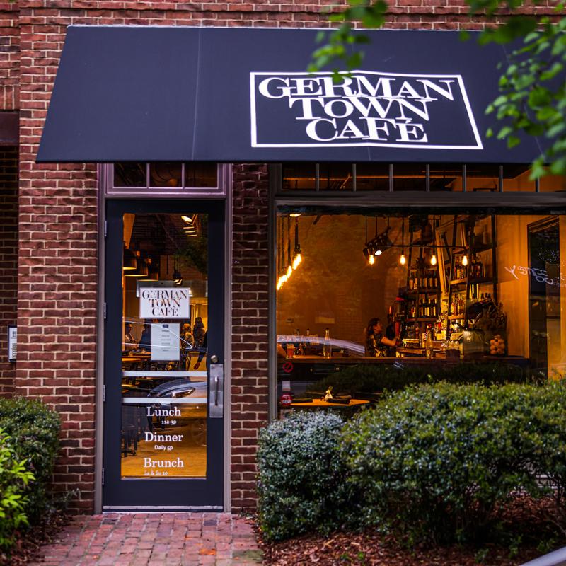 Germantown Cafe storefront on 5th Avenue North at dusk