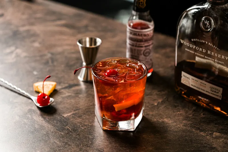 Old Fashioned with Kentucky bourbon, bitters, and bar tools